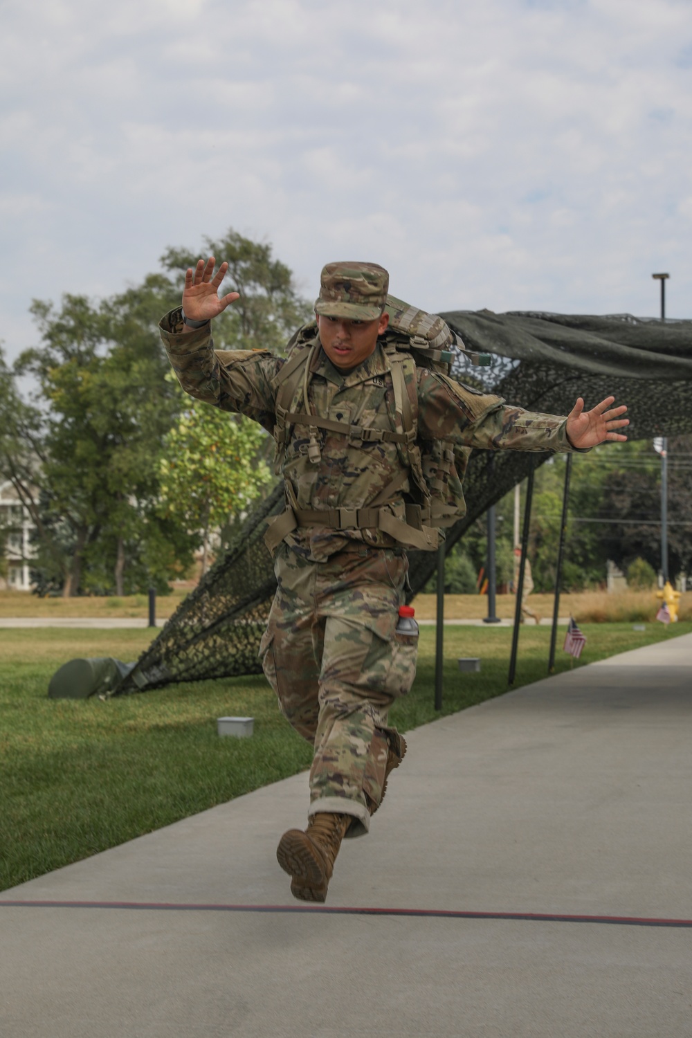 Spc. Brian Tiet crosses the finish line