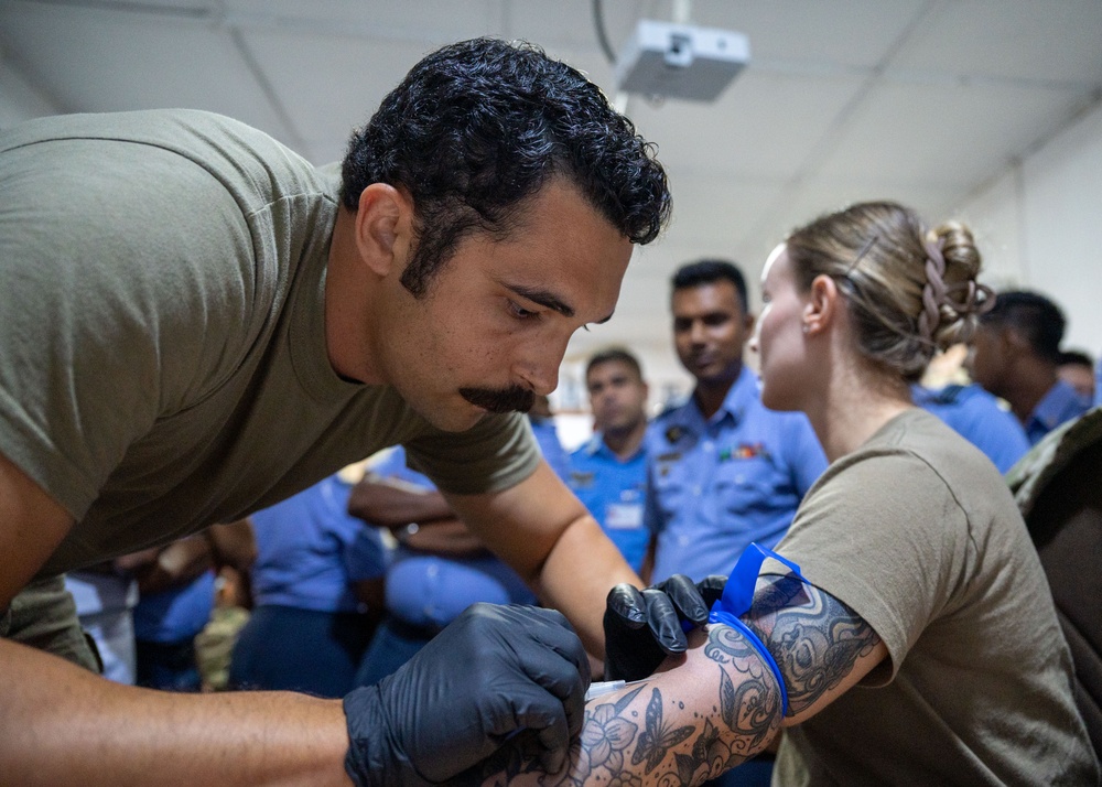 Air Force medical technicians brief Sri Lankan military doctors and public health officials during PAC Angel 25-1