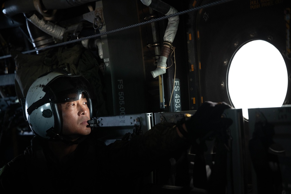 U.S. Marine MV-22B Ospreys refuel at night off the coast of Kagoshima, Japan