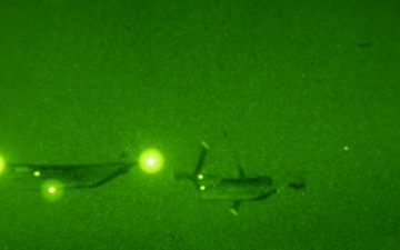 U.S. Marine MV-22B Ospreys refuel at night off the coast of Kagoshima, Japan