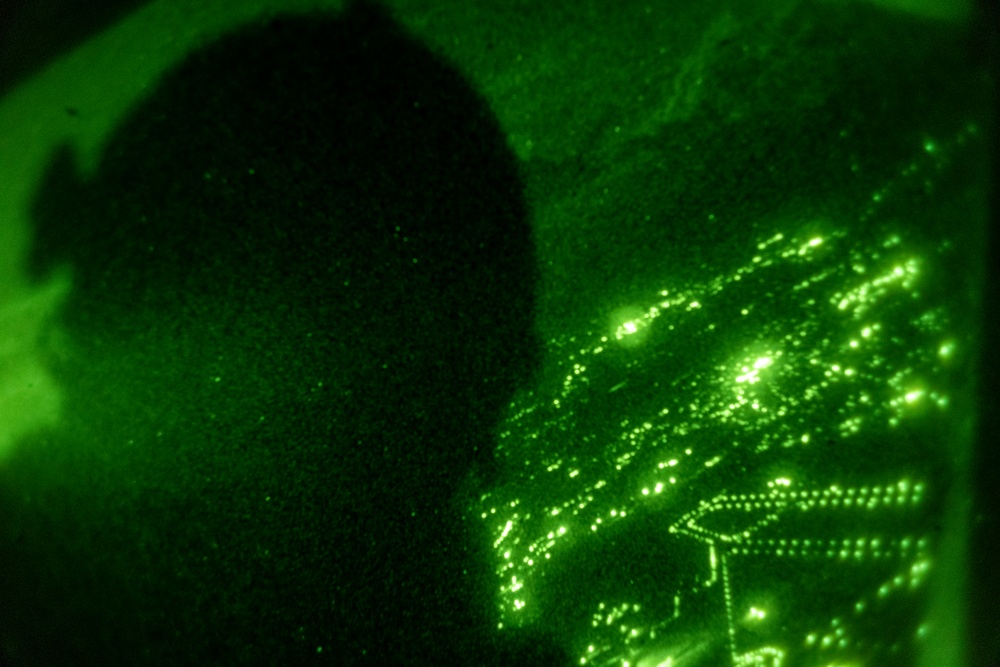 U.S. Marine MV-22B Ospreys refuel at night off the coast of Kagoshima, Japan
