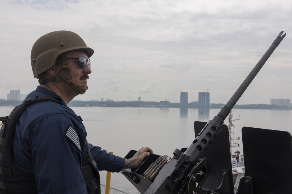 USS Frank Cable (AS 40) departs Singapore
