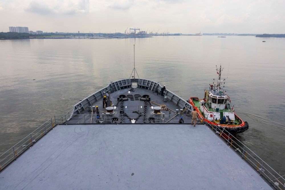 USS Frank Cable (AS 40) departs Singapore