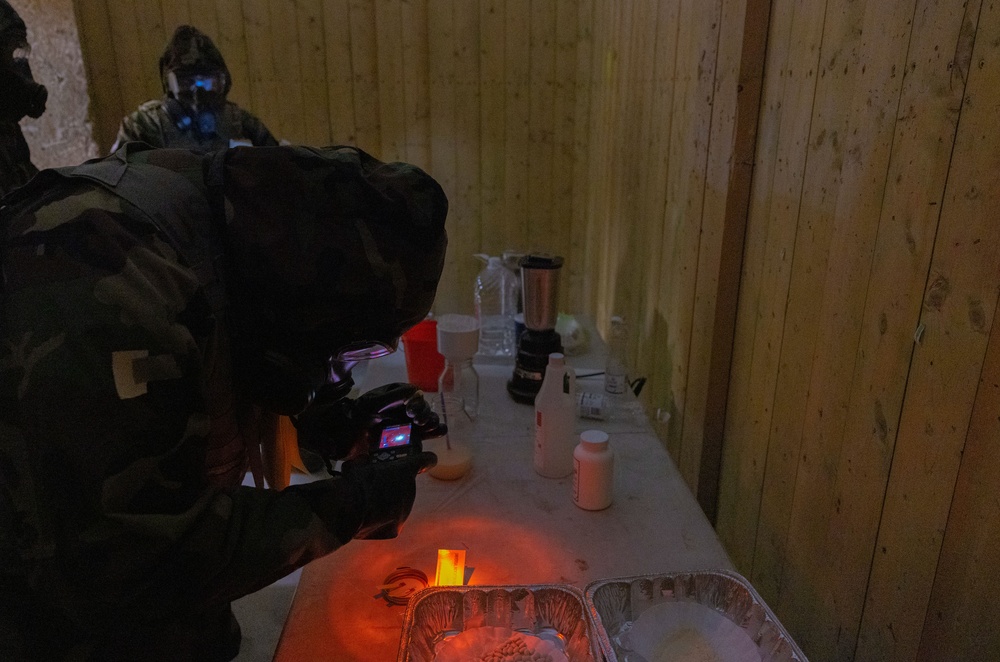 U.S. Army Soldiers document an unknown substance in a hazardous site