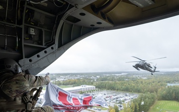 Alaska Army National Guard helicopter aviators conduct flyover for Wasilla High School football game