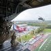 Alaska Army National Guard helicopter aviators conduct flyover for Wasilla High School football game