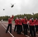 Alaska Army National Guard helicopter aviators conduct flyover for Wasilla High School football game