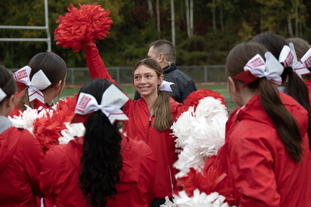 Alaska Army National Guard helicopter aviators conduct flyover for Wasilla High School football game