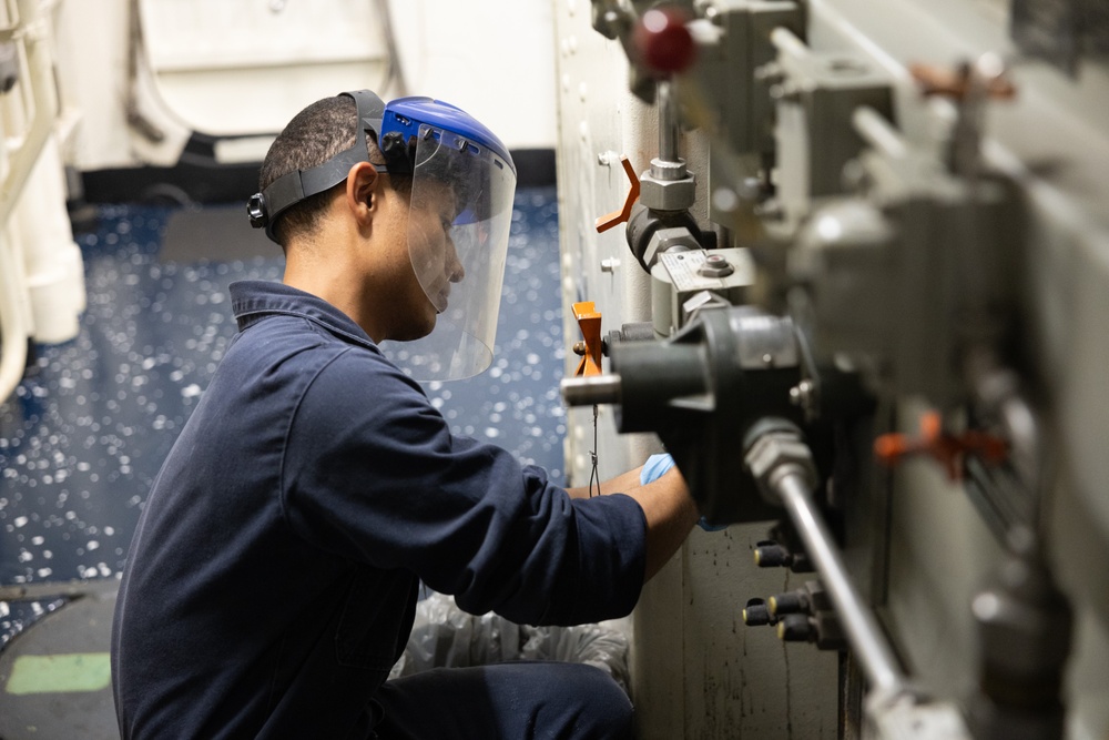 USS Curtis Wilbur (DDG 54) Sailor Conducts Maintenance