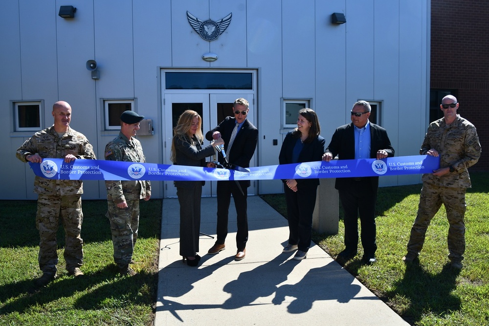 Customs and Border Protection Commissioner Rodney Scott and leaders cut the symbolic ribbon, officially opening the SRT training center on Fort A.P. Hill