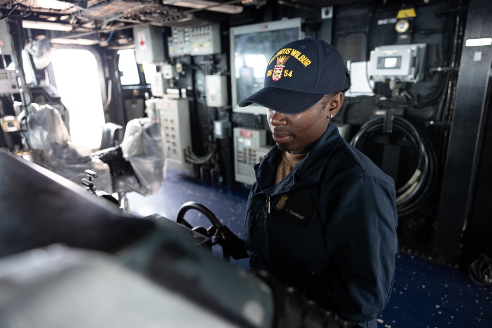 USS Curtis Wilbur (DDG 54) Sailor Mans The Helm