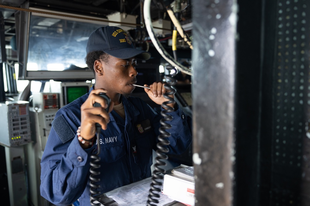 USS Curtis Wilbur (DDG 54) Sailor Conducts Boatswain's Pipe Call