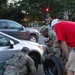 South Carolina Army National Guardsmen help a citizen with replacing a flat tire
