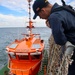 IT1 William O’Neil observes the departure of the port pilot during a sea-and-anchor evolution