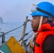 SN Connor Bailey takes his statio on the foc’sle for a replenishment-at-sea  during exercise Northern Coasts 2025