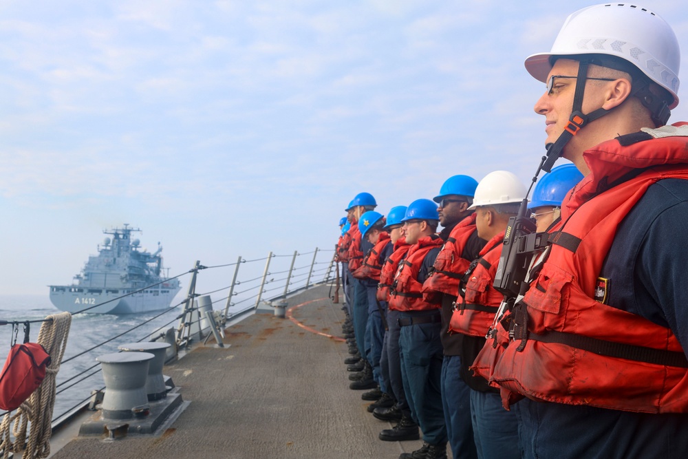 USS Bulkeley (DDG 84) Sailors man the rails prior to a replenishment-at-sea during exercise Northern Coasts 2025