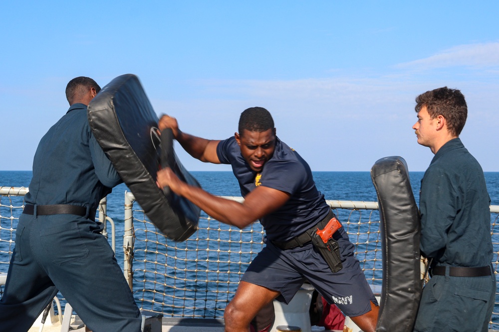 CTT1 Darren Grant and GM3 Daniel Kininmonth conduct non-lethal weapons training during exercise Northern Coasts 2025