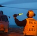 BM1 Jason Carpenter signals to pilots during exercise Northern Coasts 2025
