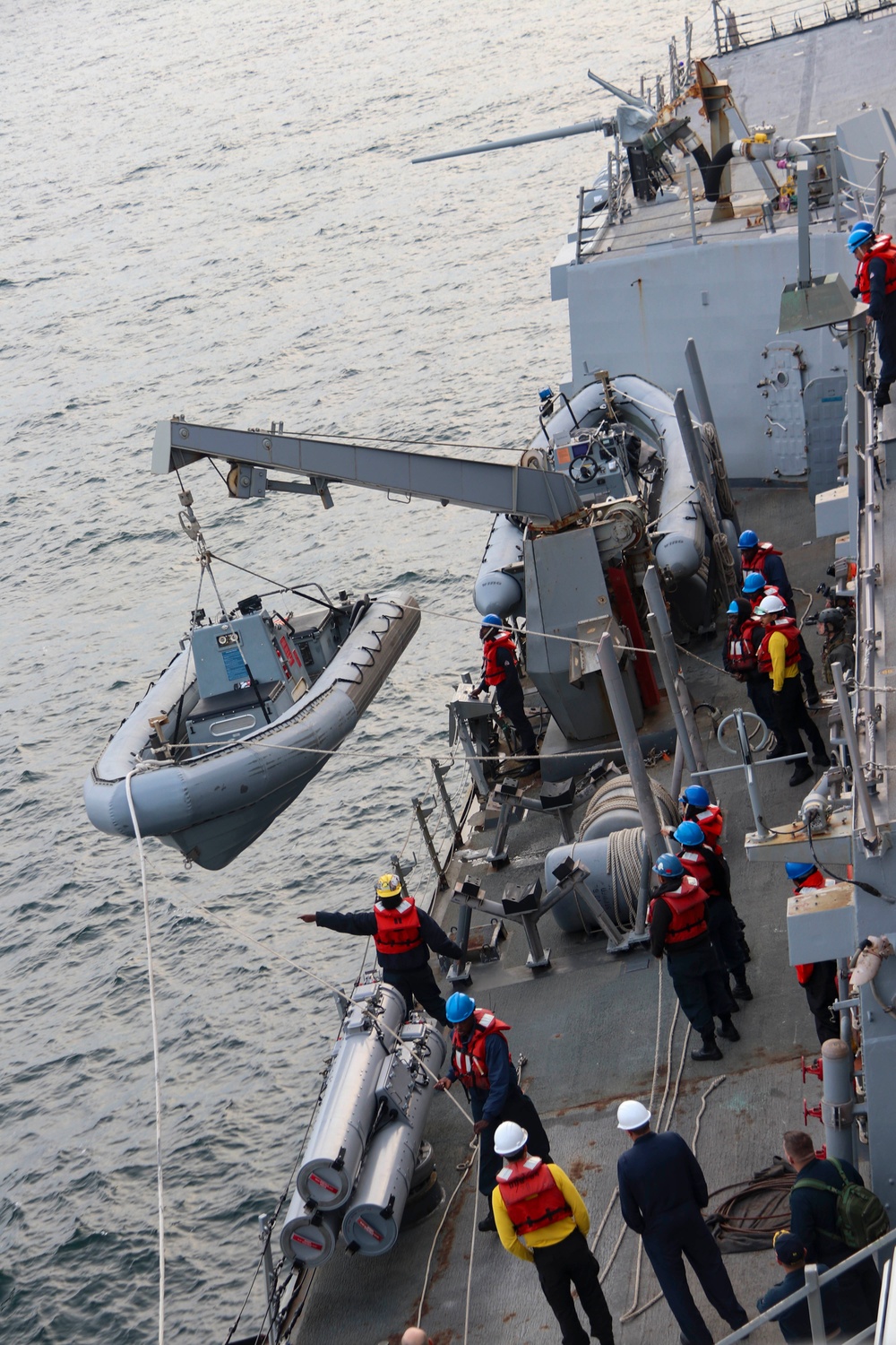 USS Bulkeley (DDG 84) Sailors launch the rigid-hulled inflatable boat for small boat operations during exercise Northern Coasts 2025
