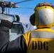 BM1 Jason Carpenter signals to pilots during exercise Northern Coasts 2025