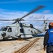 BM3 Carlens Milice awaits the signal to remove chock and chains from the MH-60R Sea Hawk helicopter during exercise Northern Coasts 2025