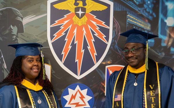 7th Signal Command (Theater) G-3's Ms. Kellie Bryant and Mr. Adekunle Ojo celebrate earning their Master's degrees, Ft. Meade, MD, April 4, 2025.