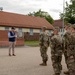 U.S. Soldiers stand in formation as U.S. Ambassador to NATO delivers remarks