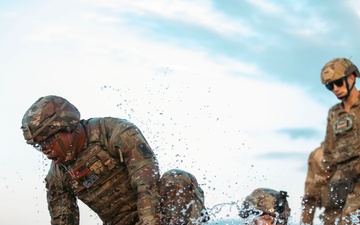 Mud, Muscle, and Multinational Might: German-Led 'Saulauf' Challenges NATO Troops and Builds Camaraderie