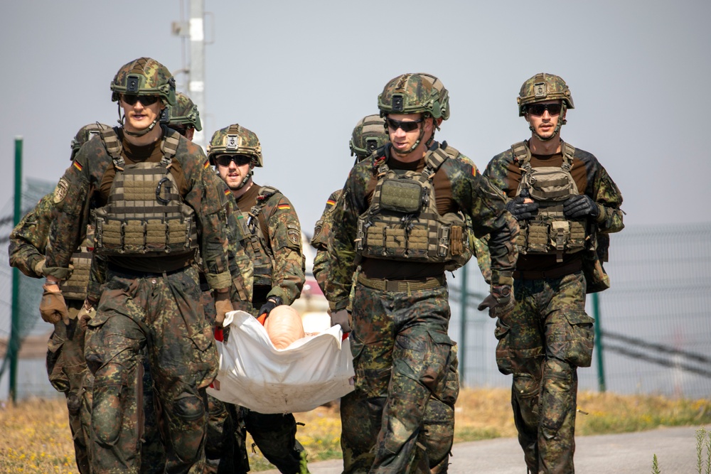 Mud, Muscle, and Multinational Might: German-Led 'Saulauf' Challenges NATO Troops and Builds Camaraderie