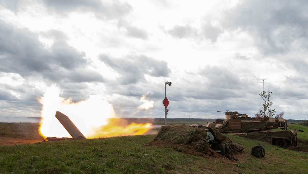 U.S. Abrams tank fires during live-fire demonstration at Iron Defender 25