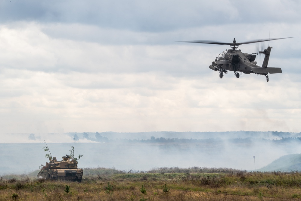 U.S. Apache provides air support for Abrams tanks at Iron Defender 25