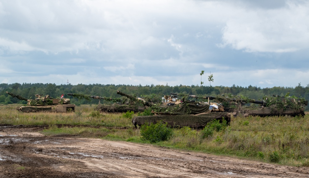 Polish and U.S. tanks stage during Iron Defender-25