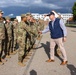 U.S. Ambassador to NATO shakes hands with U.S. Army Soldiers after Iron Defender-25