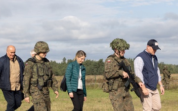 U.S. Ambassador to NATO walks alongside Polish Land Forces officers at Iron Defender-25