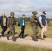 U.S. Ambassador to NATO walks alongside Polish Land Forces officers at Iron Defender-25