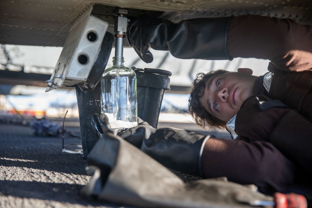 HSC-9 Sailor Collects Fuel Sample HSC-9 Sailor Collects Fuel Sample