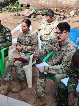 SETAF-AF civil affairs noncommissioned officer translates French for his team in West Africa