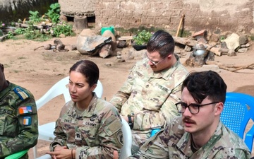 SETAF-AF civil affairs noncommissioned officer translates French for his team in West Africa