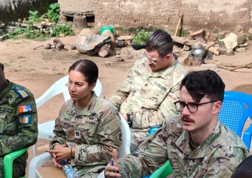SETAF-AF civil affairs noncommissioned officer translates French for his team in West Africa