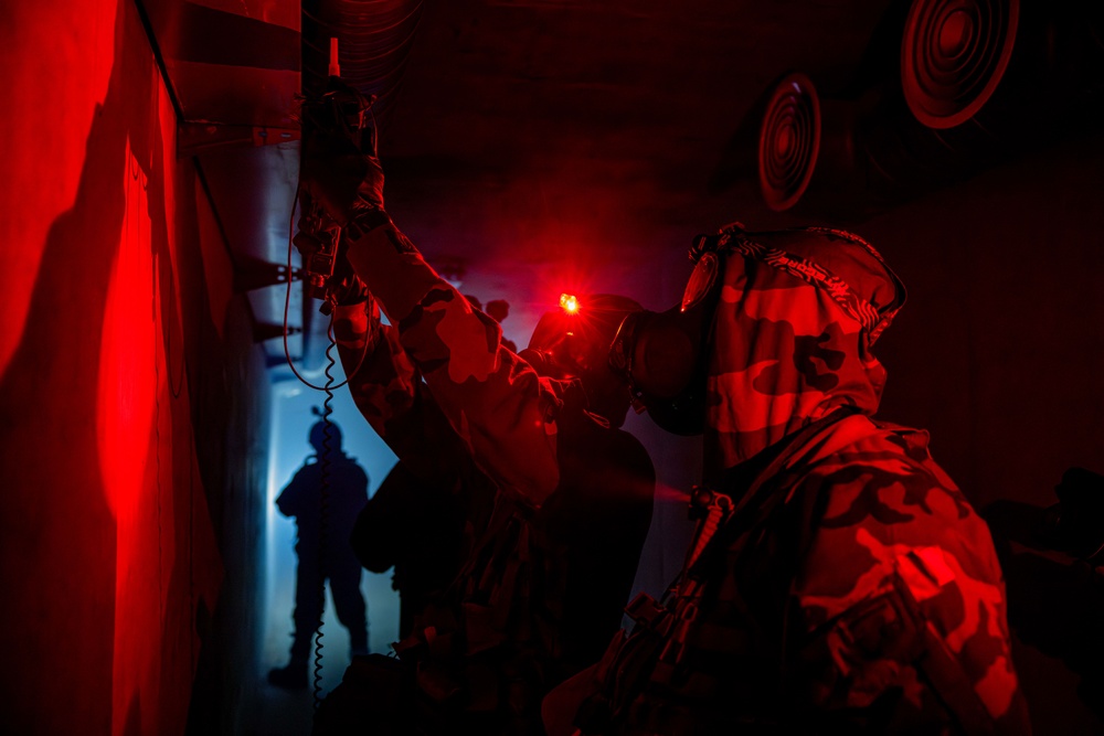 U.S. Army Soldiers test for unknown substances in an underground tunnel