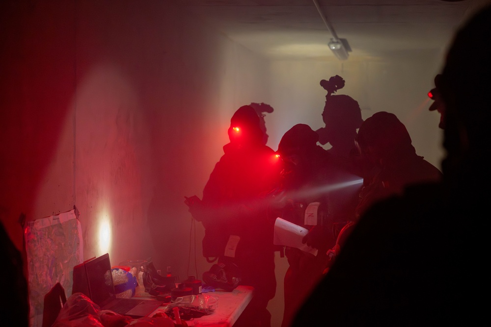 U.S. Army Soldiers test for unknown substances in an underground tunnel