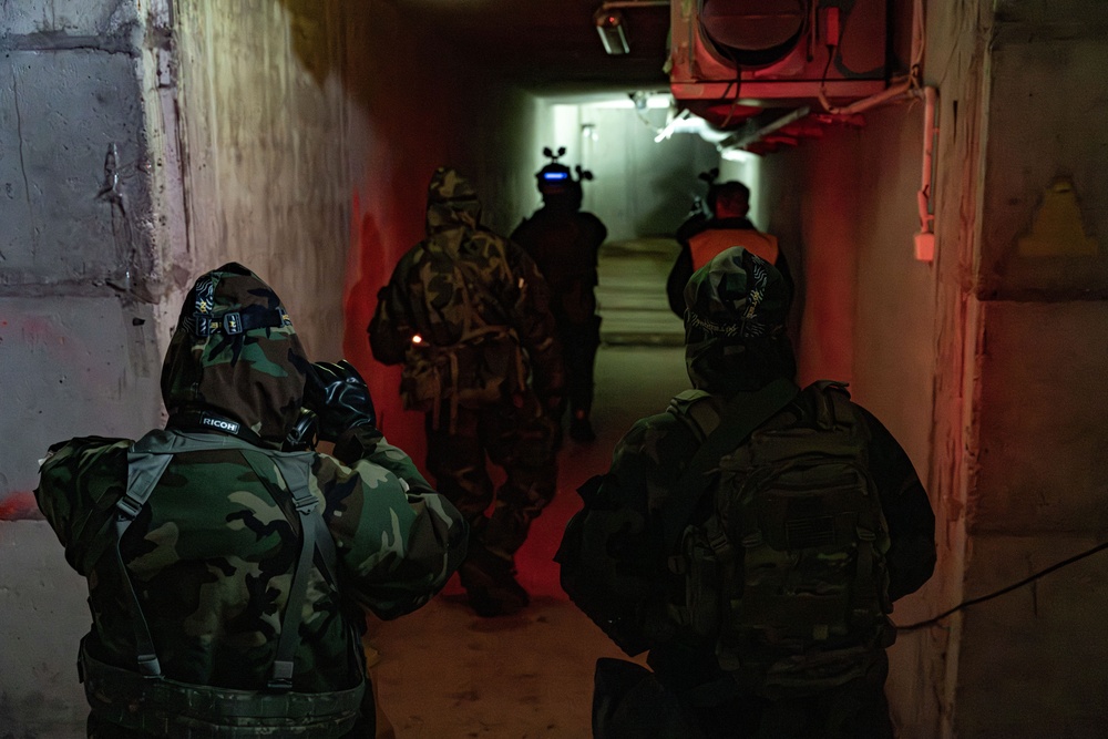 U.S. Army Soldiers and Czech Armed Forces prepare to enter an underground tunnel