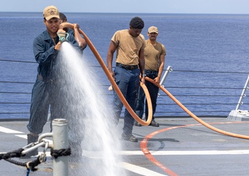 Sailors aboard the USS Dewey conduct a Freshwater Wash-Down