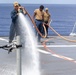 Sailors aboard the USS Dewey conduct a Freshwater Wash-Down