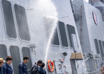 Sailors aboard the USS Dewey conduct a Freshwater Wash-Down