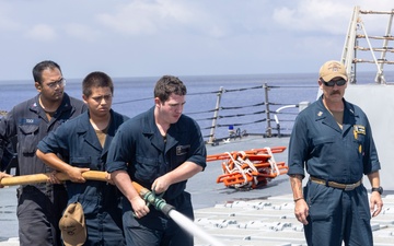 Sailors aboard the USS Dewey conduct a Freshwater Wash-Down