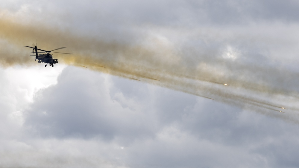 U.S. Army AH-64 Apache fires rockets during Iron Defender-25
