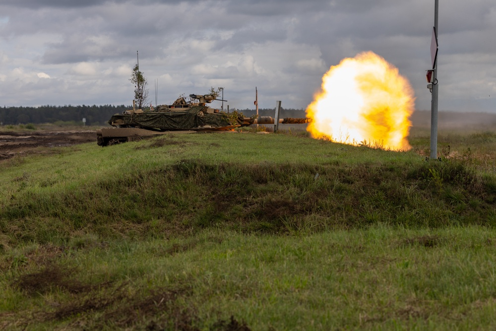 U.S. Army M1A2 Abrams tank fires rounds during Iron Defender-25