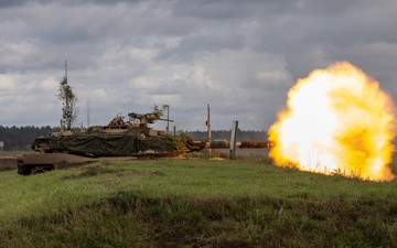U.S. Army M1A2 Abrams tank fires rounds during Iron Defender-25