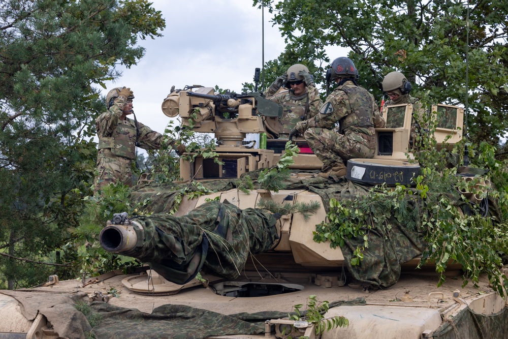 U.S. Soldiers prepare an M1A2 Abrams tank before Iron Defender-25